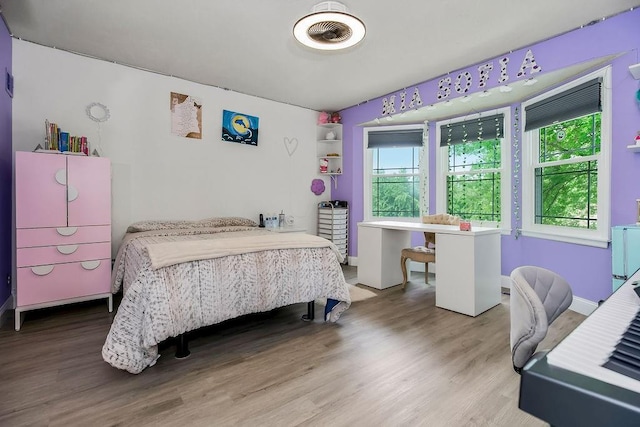 11506 Knox St, Overland Park, KS 66210 - bedroom featuring wood finished floors and baseboards