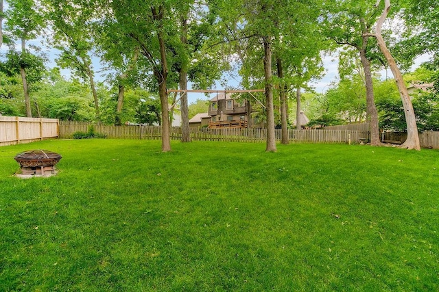 11506 Knox St, Overland Park, KS 66210 - fenced backyard with a fire pit