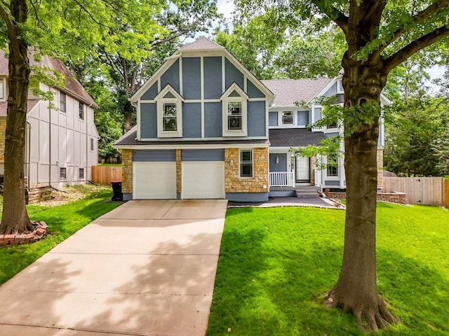 11506 Knox St, Overland Park, KS 66210 - tudor home with stone siding, an attached garage, a shingled roof, driveway, and stucco siding