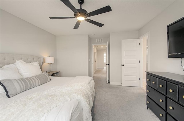 bedroom with light carpet, baseboards, and ceiling fan