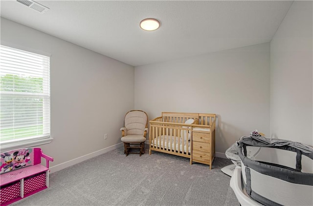 carpeted bedroom with baseboards