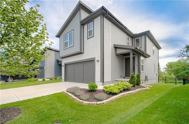 18061 W Hauser St, Overland Park, KS 66013 - view of front facade featuring a garage and concrete driveway