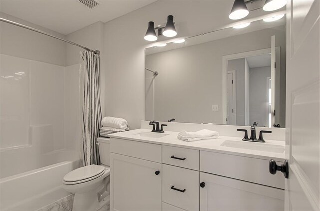 18061 W Hauser St, Overland Park, KS 66013 - bathroom with toilet, shower / tub combo with curtain, double vanity, and marble finish floors