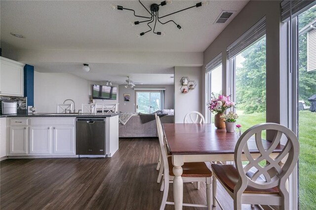 8008 NE Elmwood Ave, Kansas City, MO 64119 - dining room featuring dark wood-type flooring, plenty of natural light, and ceiling fan