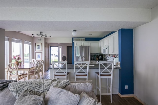 8008 NE Elmwood Ave, Kansas City, MO 64119 - living area with wood finished floors and baseboards