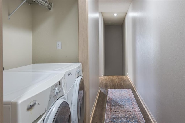 8008 NE Elmwood Ave, Kansas City, MO 64119 - laundry room with separate washer and dryer, wood finished floors, and baseboards