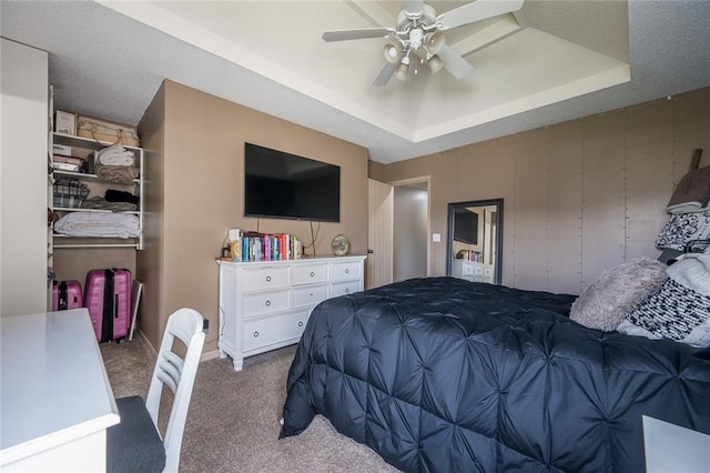 8008 NE Elmwood Ave, Kansas City, MO 64119 - bedroom with carpet floors, a raised ceiling, and a ceiling fan