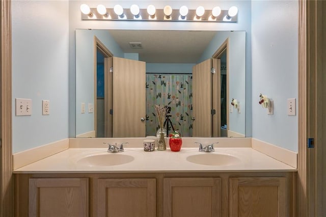 8008 NE Elmwood Ave, Kansas City, MO 64119 - bathroom featuring double vanity