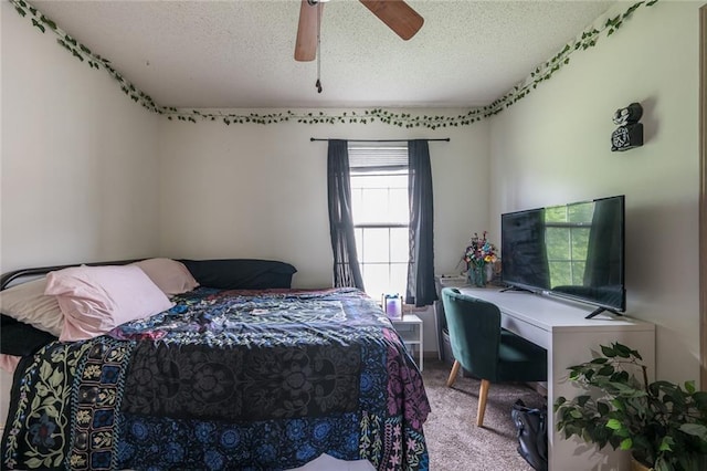 8008 NE Elmwood Ave, Kansas City, MO 64119 - carpeted bedroom with a textured ceiling, an office area, and ceiling fan