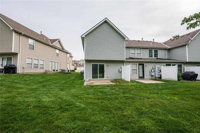 8008 NE Elmwood Ave, Kansas City, MO 64119 - back of house featuring a yard and a patio area