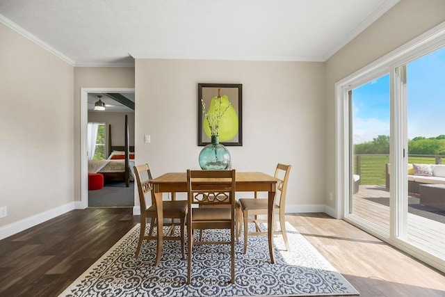 85 Birdie Ln, Mound City, KS 66056 - dining space featuring wood finished floors, crown molding, baseboards, and ceiling fan