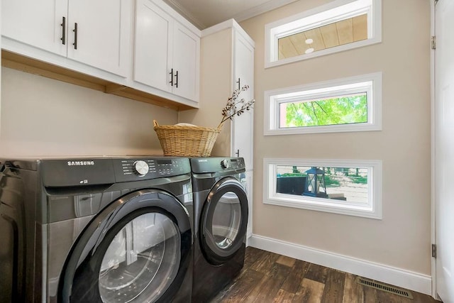 85 Birdie Ln, Mound City, KS 66056 - laundry area featuring cabinet space, baseboards, washer and clothes dryer, and dark wood-style floors