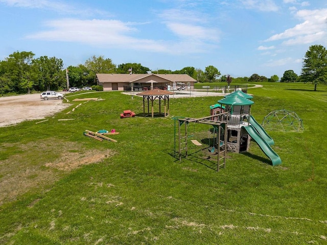 85 Birdie Ln, Mound City, KS 66056 - community jungle gym featuring a lawn