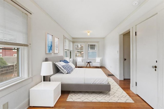 18 W 61st Ter, Kansas City, MO 64113 - bedroom featuring wood finished floors and baseboards
