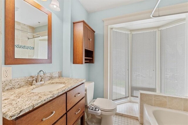 18 W 61st Ter, Kansas City, MO 64113 - bathroom with a bath, toilet, vanity, tile patterned floors, and a shower