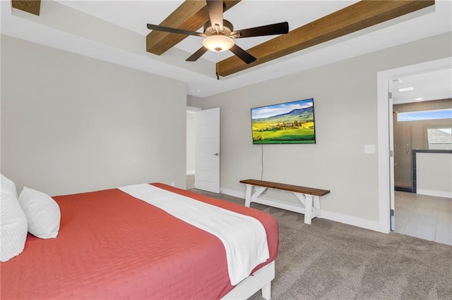 carpeted bedroom featuring baseboards and a ceiling fan