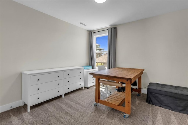 bedroom with carpet floors and baseboards