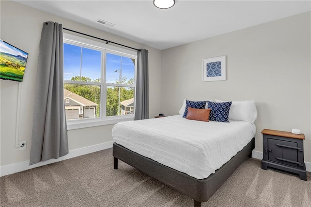 bedroom with baseboards and carpet flooring