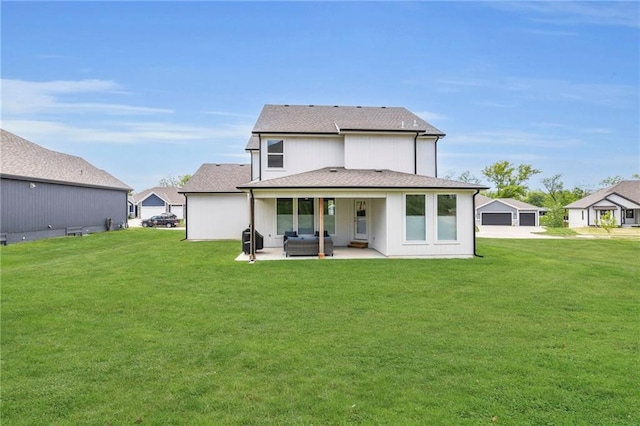 back of house with an outdoor hangout area, a patio, a lawn, and roof with shingles