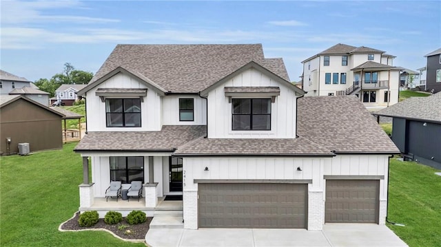 modern farmhouse style home featuring board and batten siding, roof with shingles, concrete driveway, and a front yard