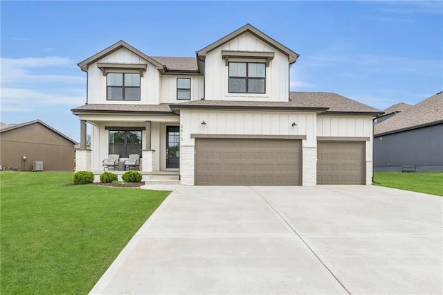 modern farmhouse style home with covered porch, a front lawn, concrete driveway, and a shingled roof