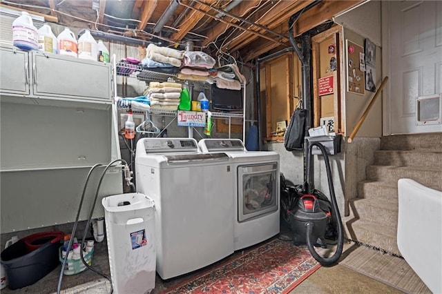 laundry room featuring cabinet space and washing machine and dryer