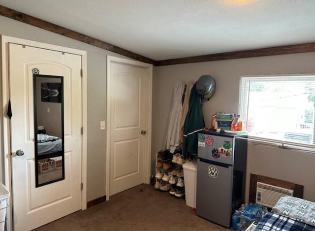 524 N Walnut St, Maryville, MO 64468 - carpeted bedroom with freestanding refrigerator