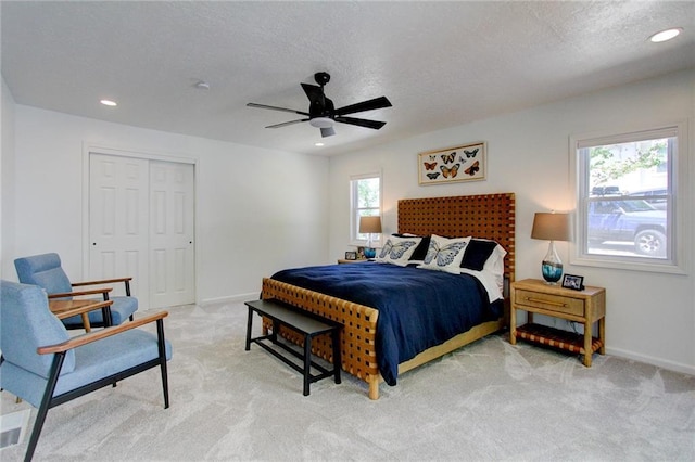 81 S Street S, St, Lake Lotawana, MO 64086 - bedroom featuring light colored carpet, recessed lighting, baseboards, a textured ceiling, and a closet