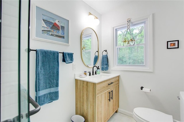 81 S Street S, St, Lake Lotawana, MO 64086 - bathroom featuring toilet, vanity, baseboards, and tile patterned floors
