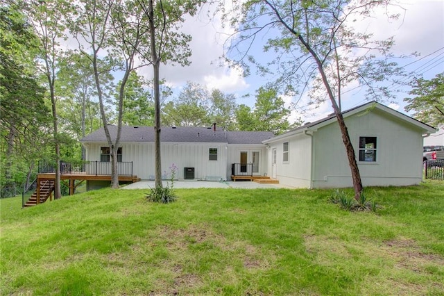 81 S Street S, St, Lake Lotawana, MO 64086 - back of house featuring french doors, stairs, a wooden deck, a yard, and board and batten siding