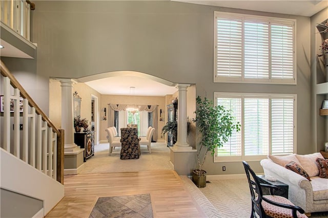 5445 NE Northgate Xing, Lees Summit, MO 64064 - foyer entrance featuring ornate columns, a towering ceiling, plenty of natural light, and stairway