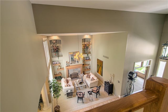 5445 NE Northgate Xing, Lees Summit, MO 64064 - living room featuring a towering ceiling and a chandelier