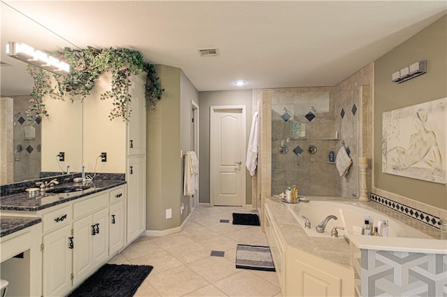 5445 NE Northgate Xing, Lees Summit, MO 64064 - bathroom with a garden tub, vanity, a tile shower, tile patterned floors, and baseboards