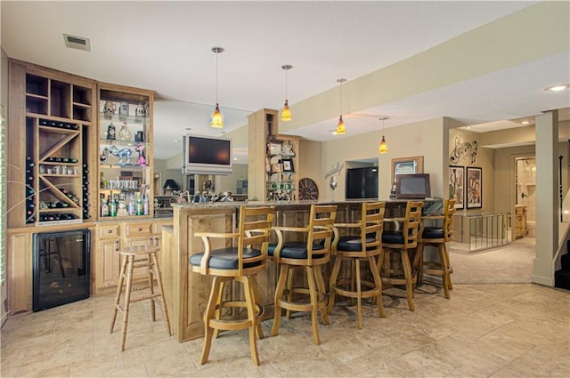 5445 NE Northgate Xing, Lees Summit, MO 64064 - indoor wet bar featuring hanging light fixtures and light stone finish floors
