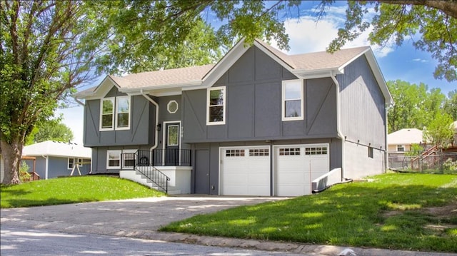 708 Cantebury Dr, Warrensburg, MO 64093 - split foyer home with driveway and an attached garage