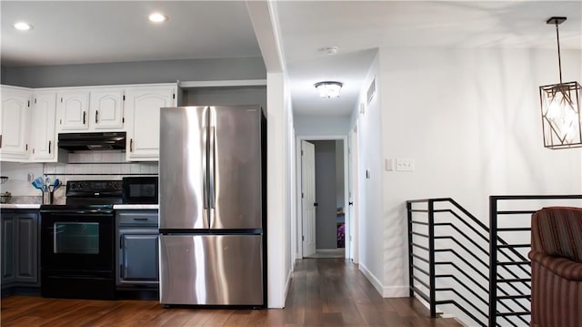 708 Cantebury Dr, Warrensburg, MO 64093 - kitchen featuring black appliances, under cabinet range hood, white cabinetry, dark wood-style floors, and recessed lighting