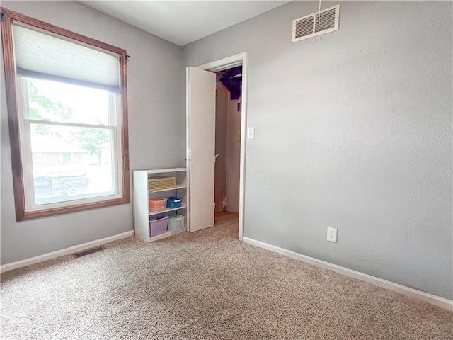 708 Cantebury Dr, Warrensburg, MO 64093 - unfurnished bedroom featuring carpet floors and baseboards
