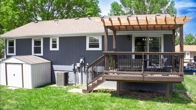 708 Cantebury Dr, Warrensburg, MO 64093 - back of property with central AC, a yard, a wooden deck, a pergola, and roof with shingles