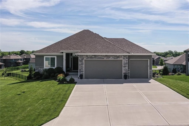 4713 NE Saratoga Ct, Lees Summit, MO 64064 - view of front facade with a garage, stone siding, concrete driveway, a shingled roof, and a residential view