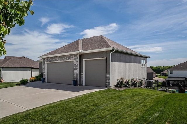 4713 NE Saratoga Ct, Lees Summit, MO 64064 - view of side of property featuring a garage, driveway, central AC, and stone siding