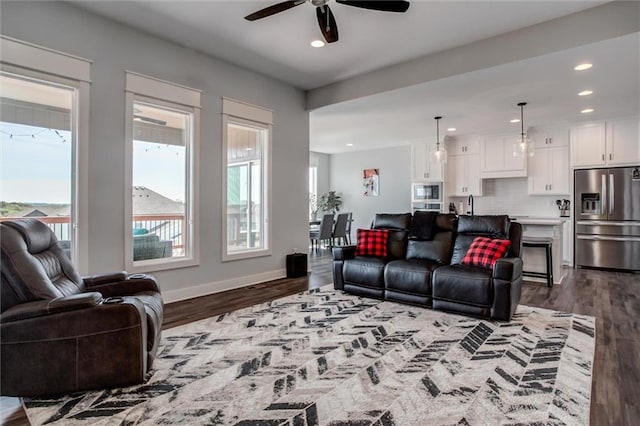 4713 NE Saratoga Ct, Lees Summit, MO 64064 - living area featuring ceiling fan, dark wood-style flooring, recessed lighting, and baseboards