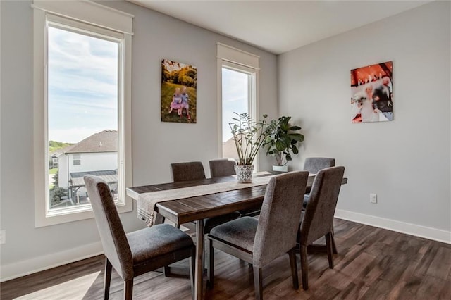4713 NE Saratoga Ct, Lees Summit, MO 64064 - dining area with dark wood-type flooring and baseboards
