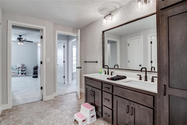 4713 NE Saratoga Ct, Lees Summit, MO 64064 - full bathroom with ceiling fan, double vanity, baseboards, and tile patterned flooring