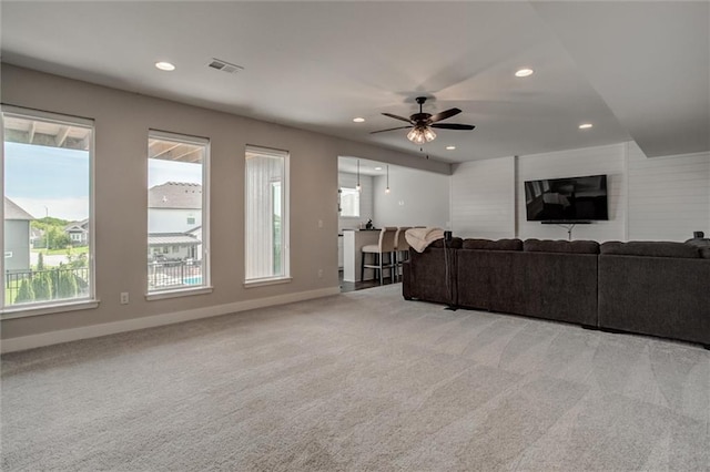 4713 NE Saratoga Ct, Lees Summit, MO 64064 - living area featuring light colored carpet, recessed lighting, baseboards, and a ceiling fan