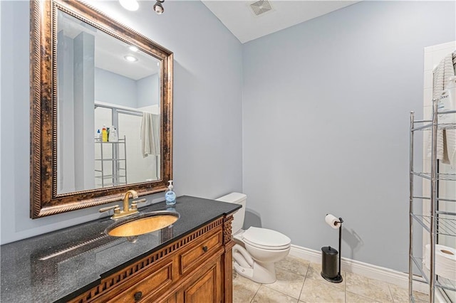 13123 W 54th Ter, Shawnee, KS 66216 - bathroom featuring toilet, a shower stall, tile patterned floors, baseboards, and vanity