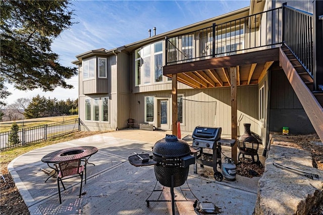 13123 W 54th Ter, Shawnee, KS 66216 - back of property featuring a patio area, an outdoor fire pit, and fence
