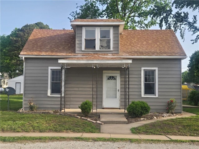 117 E Buford St, Wellington, MO 64097 - view of front of home with roof with shingles