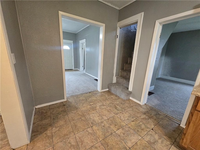 117 E Buford St, Wellington, MO 64097 - hallway with carpet, baseboards, ornamental molding, stairway, and a textured wall