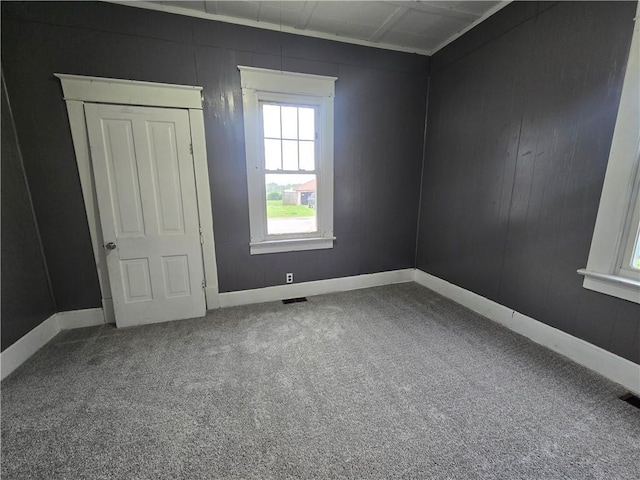 117 E Buford St, Wellington, MO 64097 - carpeted empty room featuring baseboards