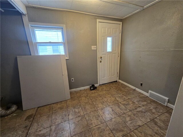 117 E Buford St, Wellington, MO 64097 - foyer with baseboards